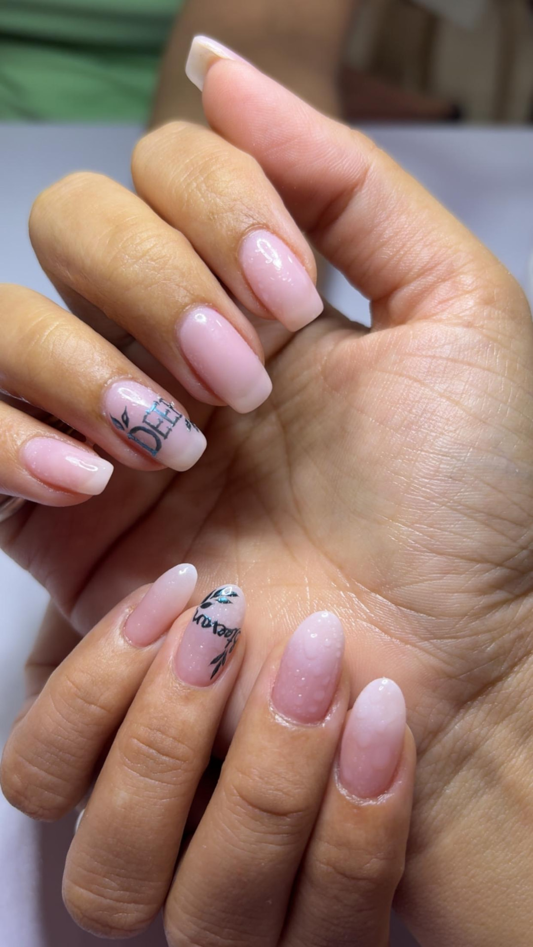 Milky pink nails with delicate hand-lettered name detail