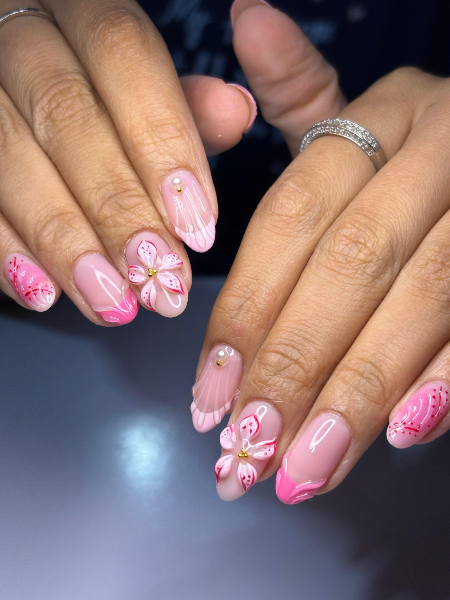 Pink nails with sculpted 3D flower and pearl embellishment