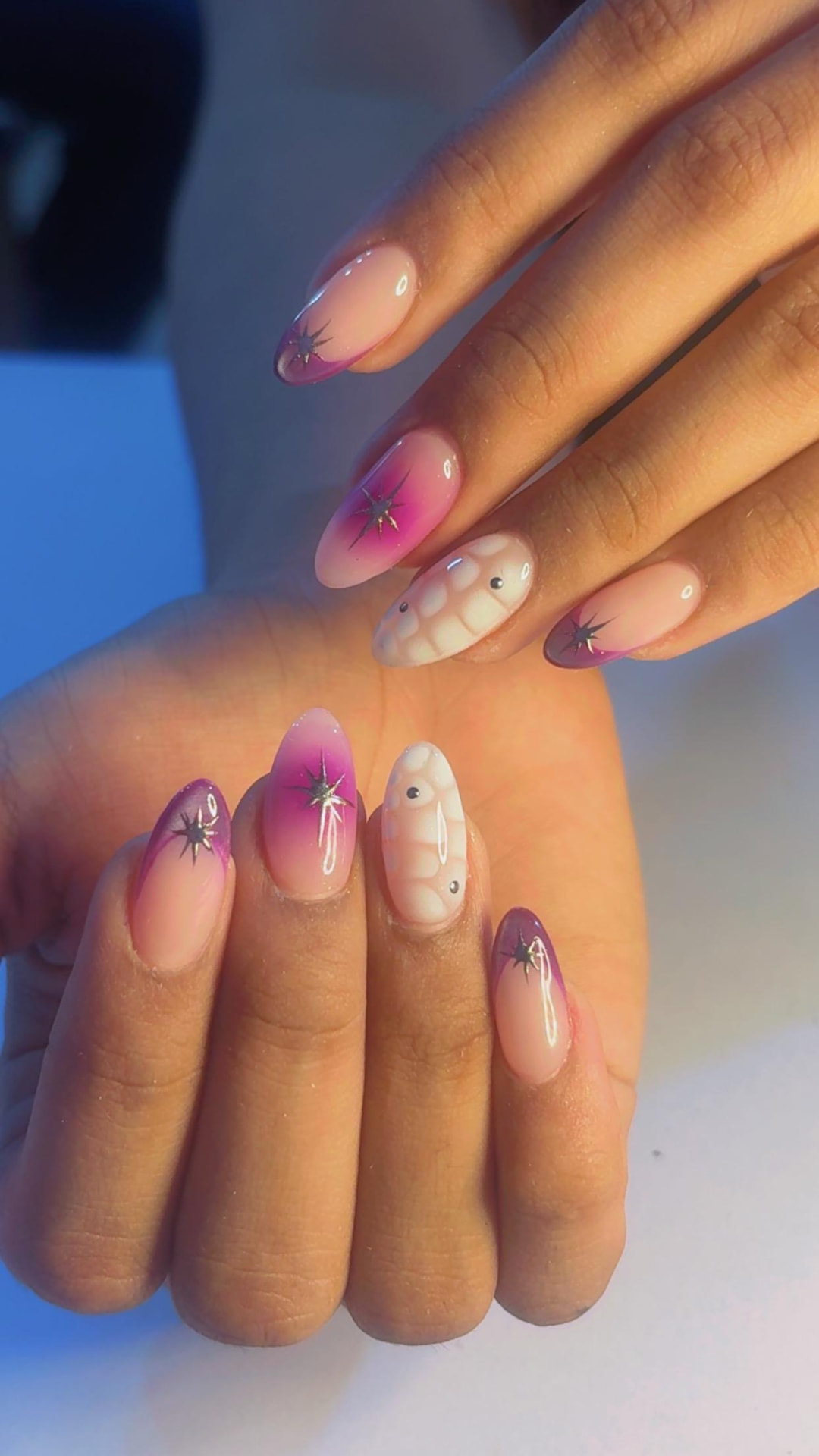 Magenta ombre French nails with chrome star accents
